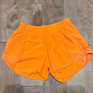 Neon orange lulu shorts size 6, 4 inch